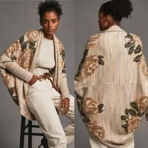 L1. Anthropologie Cream Floral Knit Poncho